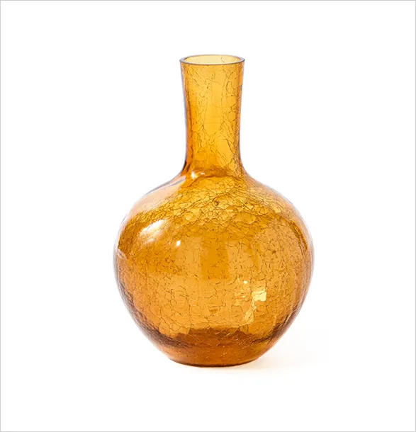 Stunning POLSPOTTEN amber glass vase with a voluptuous, crackle-textured body and slender neck. The luminous golden hue and organic shape evoke the warmth of sunset, while the intricate surface detailing adds depth and visual interest. This piece exemplifies POLSPOTTEN's mastery in creating iconic, statement-making designs that effortlessly enrich interior spaces.