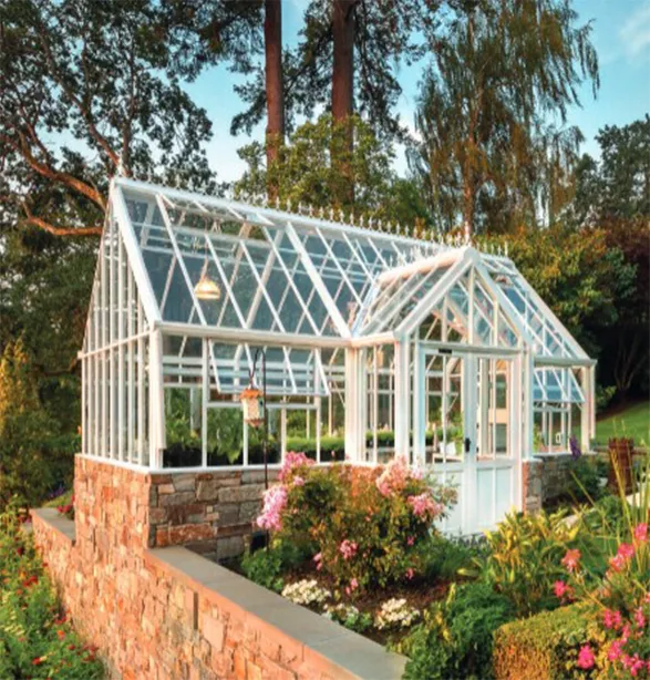Exquisite Hartley Botanic greenhouse, a paragon of Victorian-inspired elegance, nestled in a lush garden. Its pristine white frame and diamond-patterned glass panels showcase the brand's commitment to perfect design and unparalleled quality. Set upon a rustic stone base and surrounded by vibrant blooms, this RHS-endorsed masterpiece embodies Hartley Botanic's 30-year guarantee of enduring strength and everlasting performance. A timeless sanctuary for plant enthusiasts, reflecting two centuries of horticultural excellence.